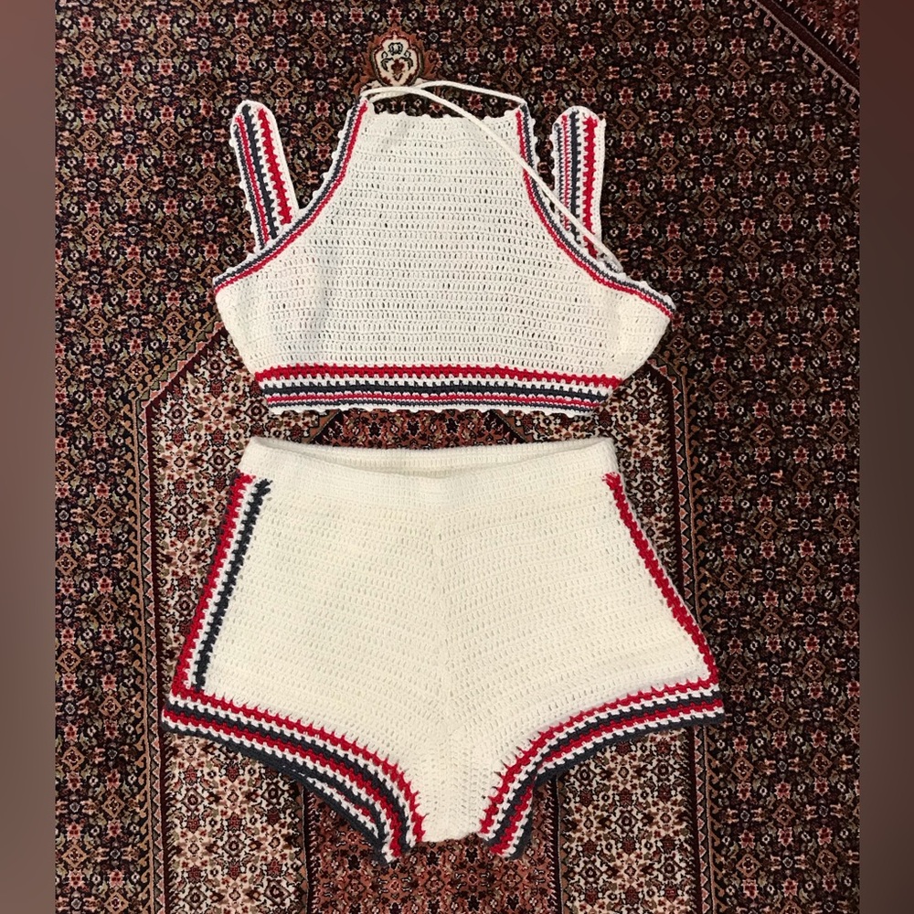 Urban outfitters white crochet two piece set with red and blue accents.